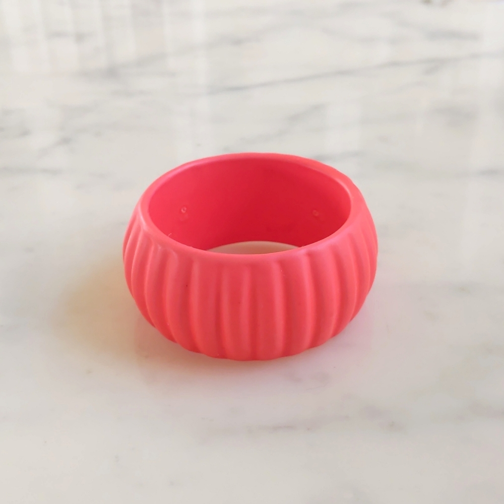 NWOT. 1.5" Orange Red Bangle Bracelet with Design.